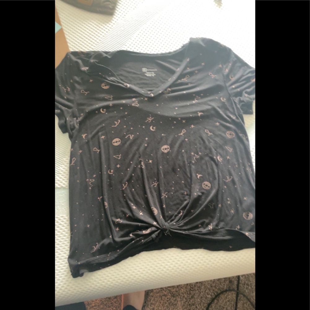 Black V neck t-shirt with rose gold zodiac sign details and sewn in tie.